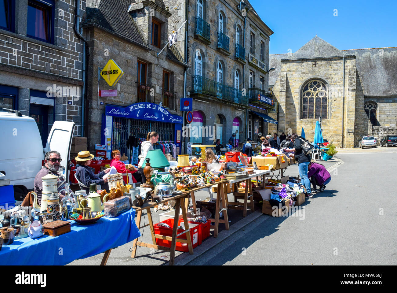 A very sunny market day in the town square in Rostrenan, Brittany, France. Stock Photo