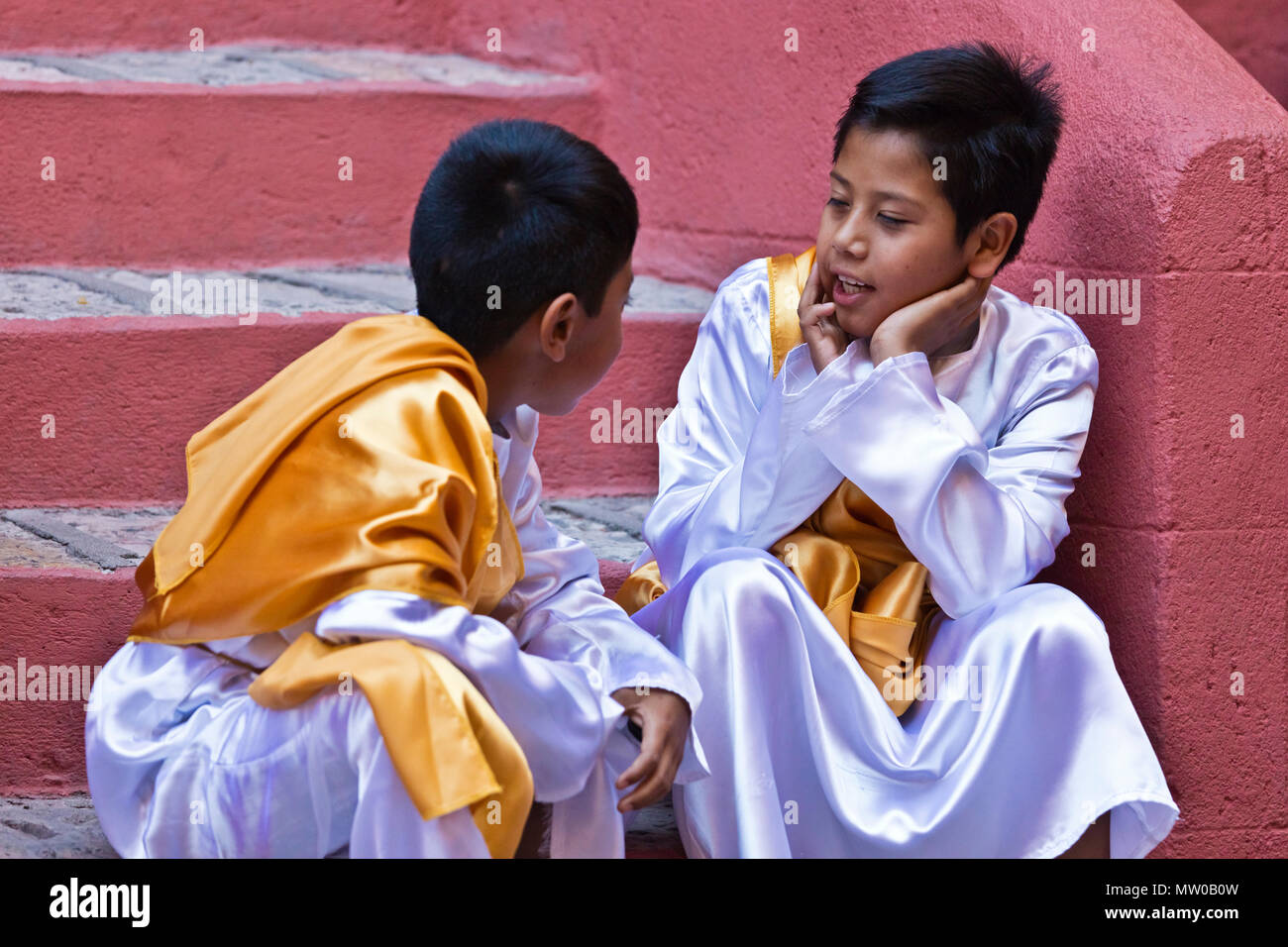 Young boys dress in costume for the Good Friday Procession (Santa Entierro) at the ORATORIO CHURCH - SAN MIGUEL DE ALLENDE, MEXICO Stock Photo