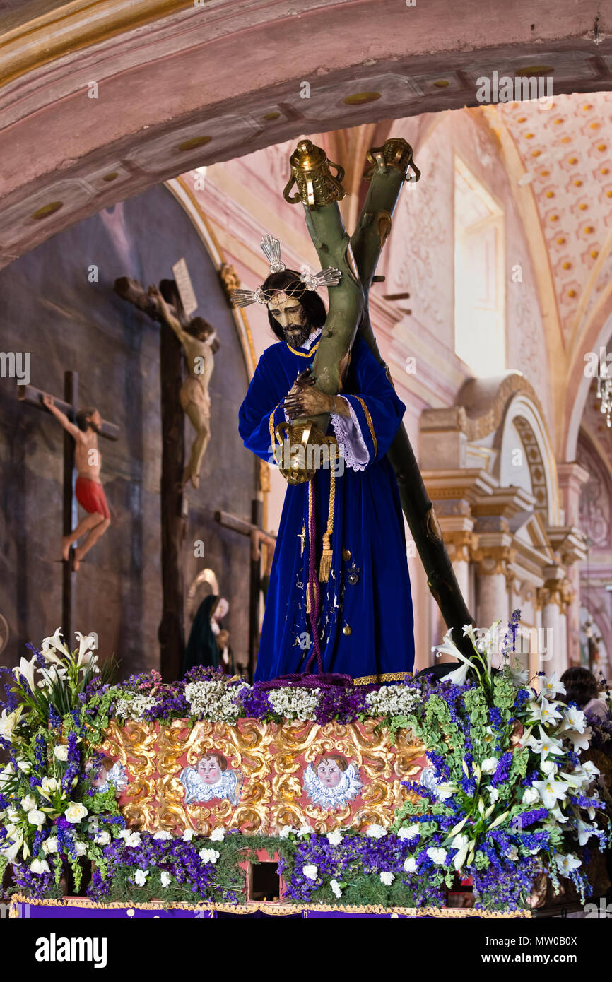 A statue of Jesus carring the cross is brought out for the Good Friday Procession (Santa Entierro) at the ORATORIO CHURCH - SAN MIGUEL DE ALLENDE, MEX Stock Photo