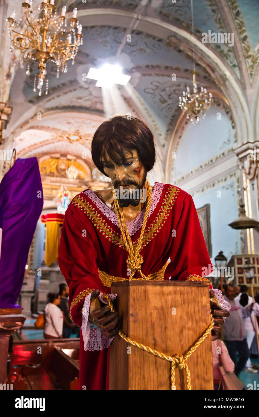 A statue of a JESUS inside the SAN RAFAEL chapel is prepared for the Good Friday Procession - SAN MIGUEL DE ALLENDE, MEXICO Stock Photo