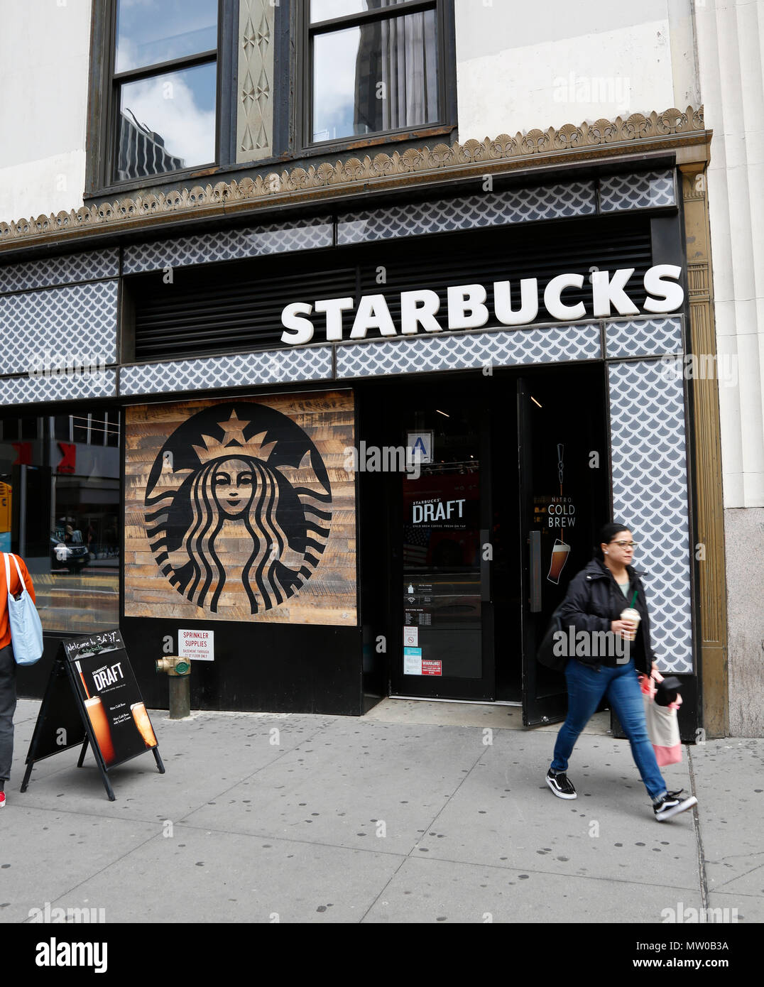 New Starbucks look in midtown Manhattan, New York City. Stock Photo
