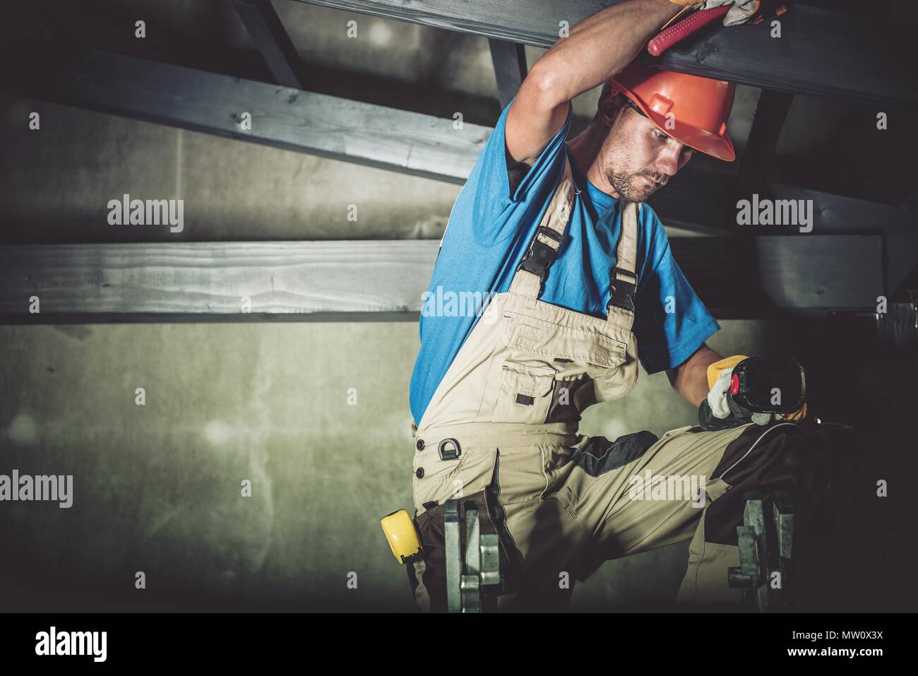 Caucasian Construction Wood Worker Carpenter in His 30s. Construction Site. Stock Photo