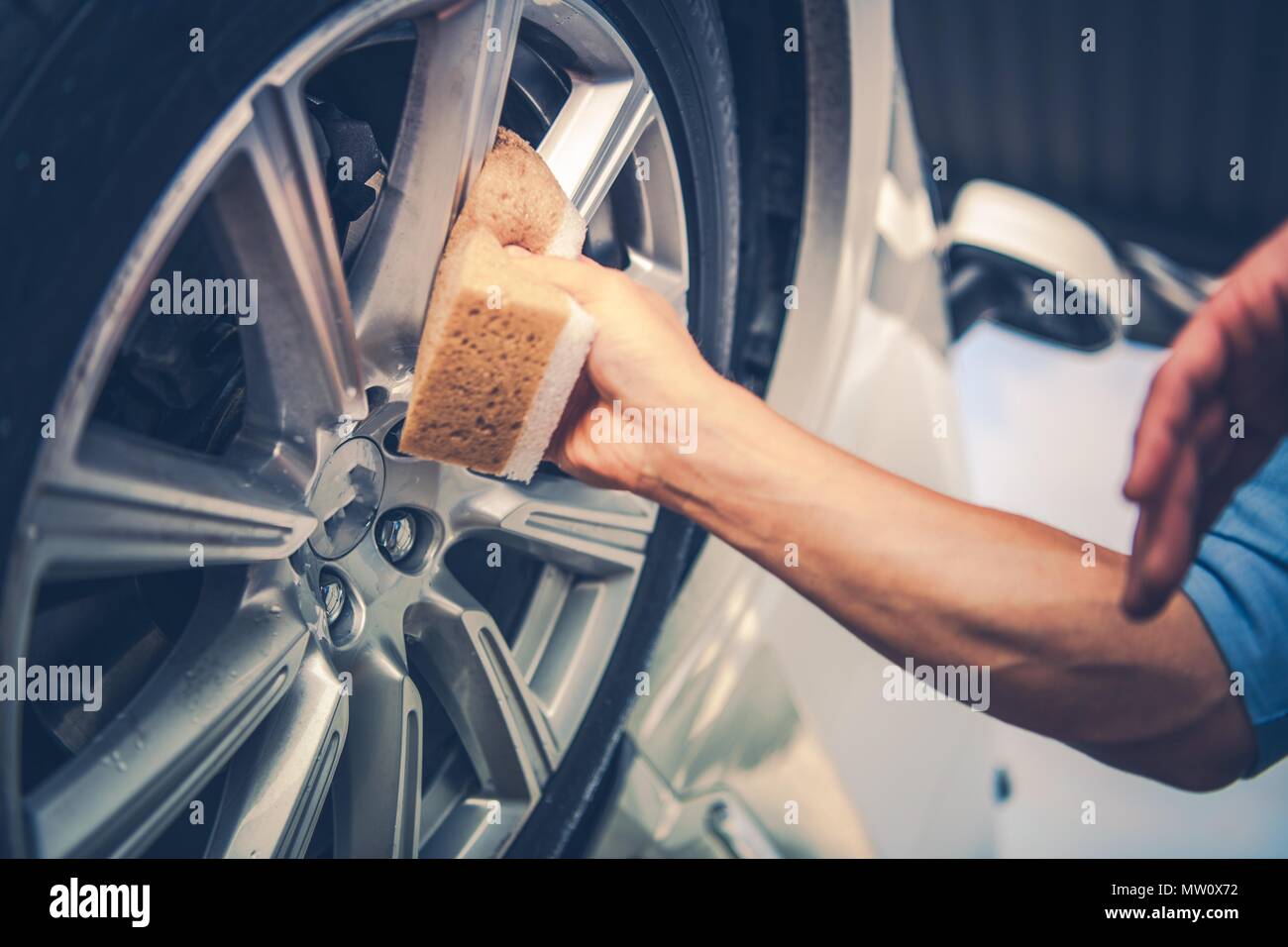 Men Cleaning Car Alloy Wheel. Vehicle Washing and Detailing Concept ...