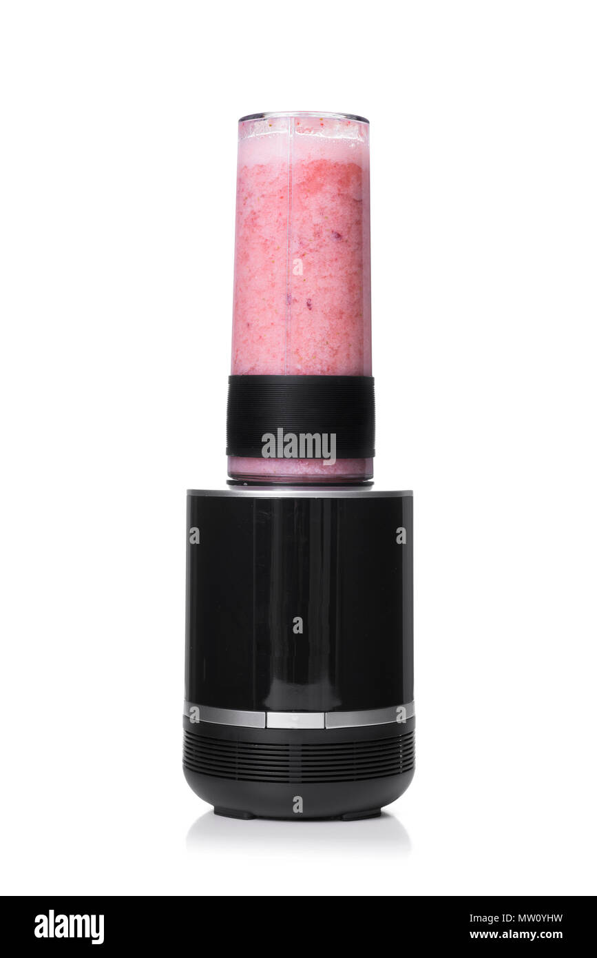 a pink smoothie in the jar of a blender, on a white background Stock Photo