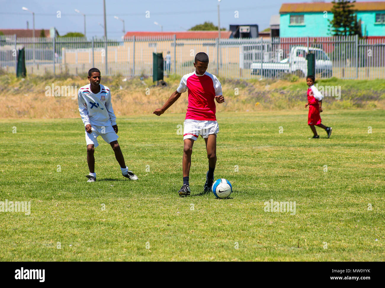 African boys playing soccer hi-res stock photography and images - Alamy