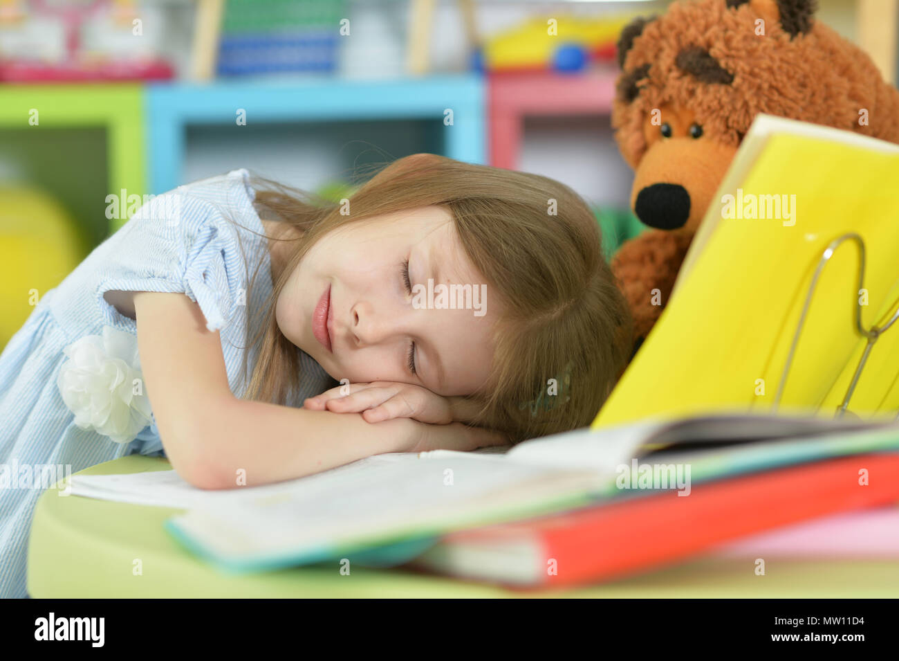 Tired schoolgirl sleeping Stock Photo