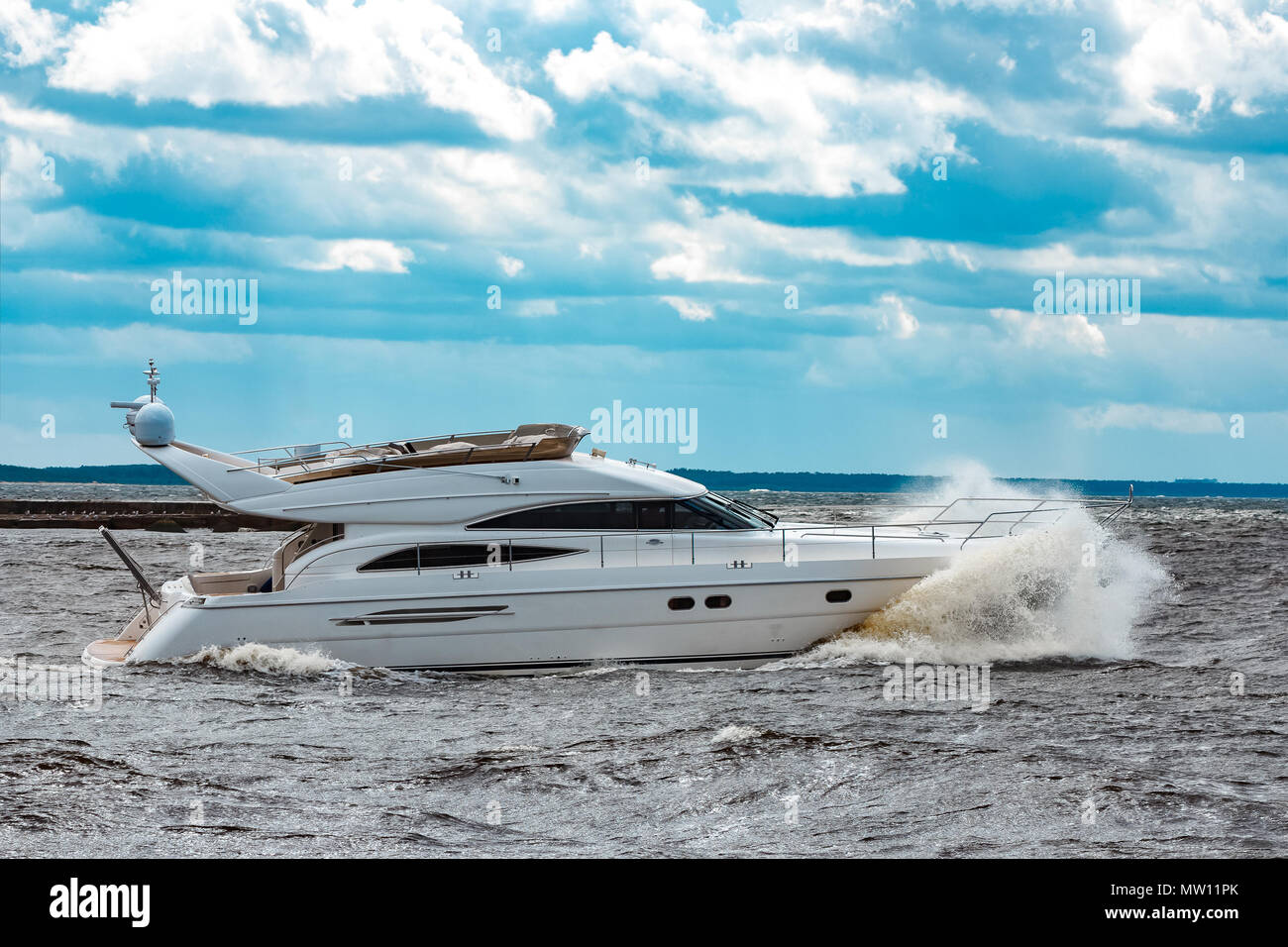 White speed boat moving fast to the Baltic sea. Water sport Stock Photo ...