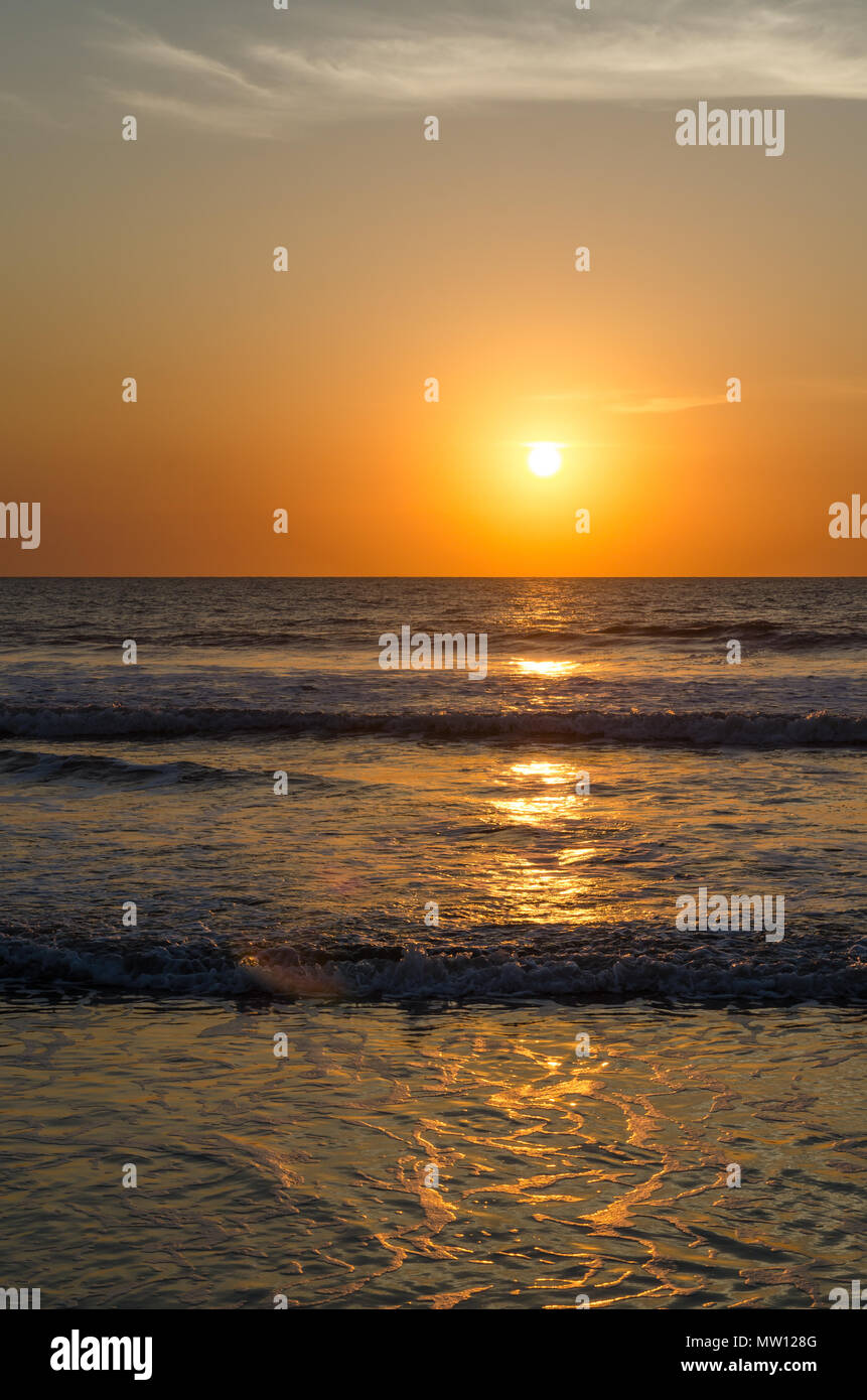 Beautiful scenic sunset at empty beach in Casamance region of Senegal, Africa. Stock Photo