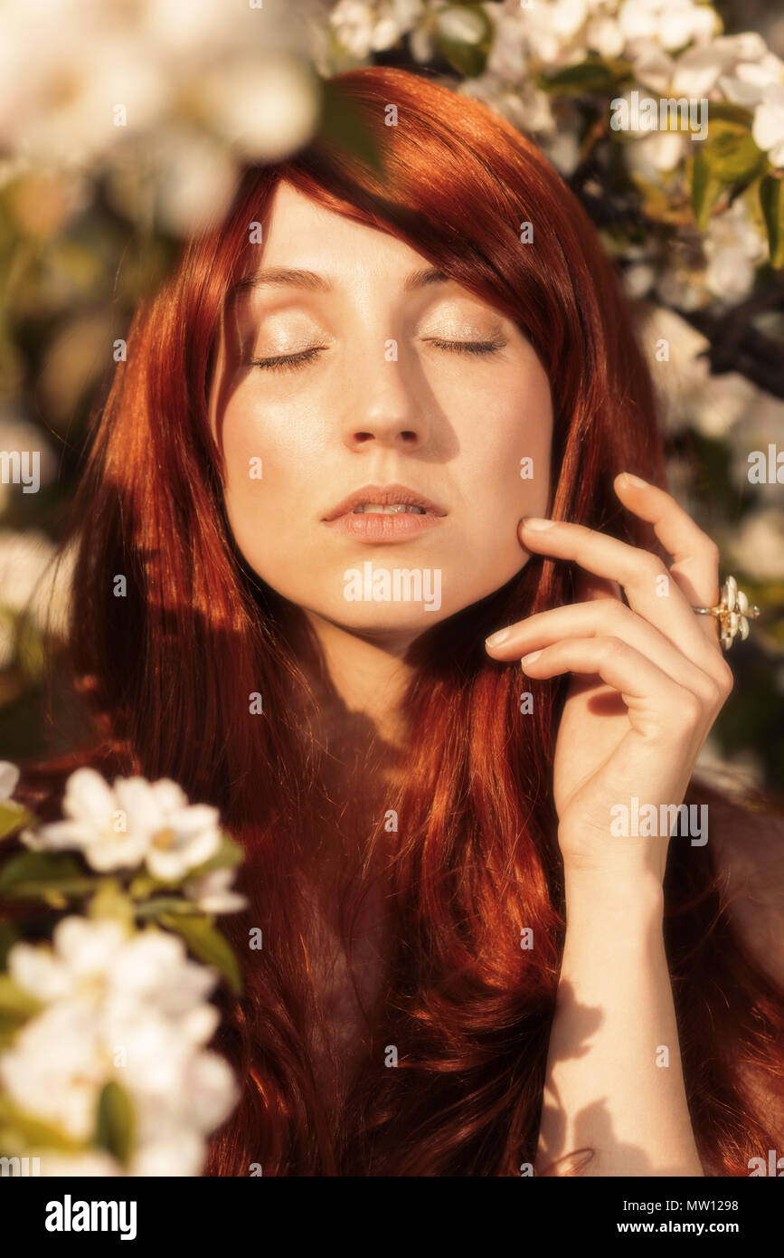 Woman eyes closed red hair hi-res stock photography and images - Alamy