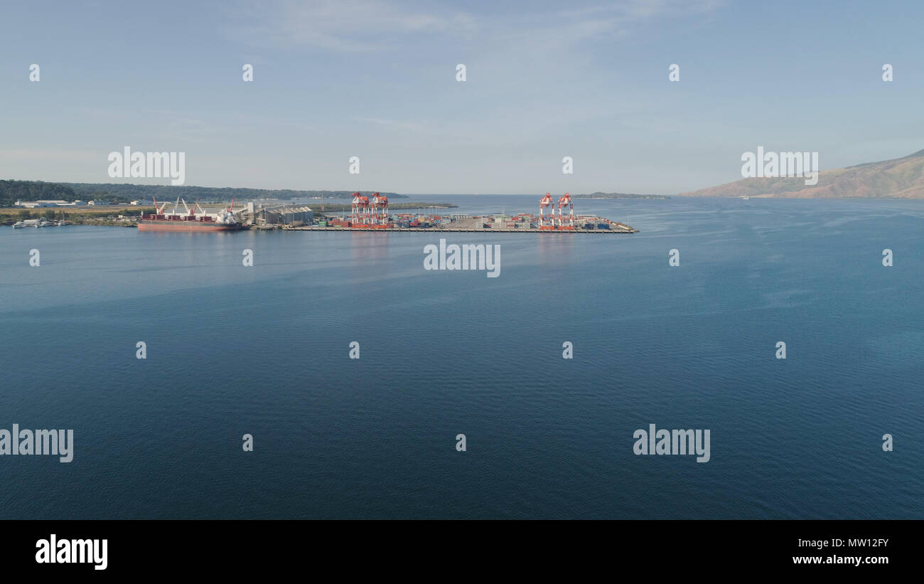Sea cargo port with cranes, docks, containers in Subic Bay. Philippines,Luzon. Aerial view: cargo port and container terminal. Stock Photo