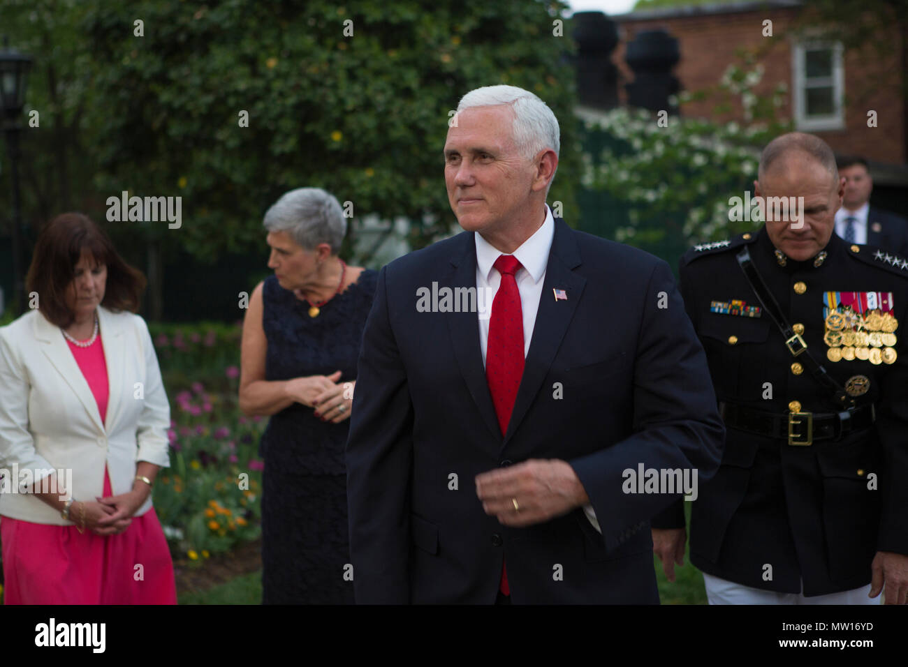Vice President of the United States Mike Pence attend a parade as the guest of honor at Marine Barracks Washington, D.C. on May 4, 2018. The hosting official was the Commandant of the Marine Corps Gen. Robert B. Neller. The evening parade summer tradition began in 1934, and features the Silent Drill Platoon, the U.S. Marine Band, the U.S. Marine Drum and Bugle Corps and two marching companies. More than 3,500 guests attend the parade every week. (U.S. Marine Corps photo by Cpl. Daisha R. Sosa) Stock Photo