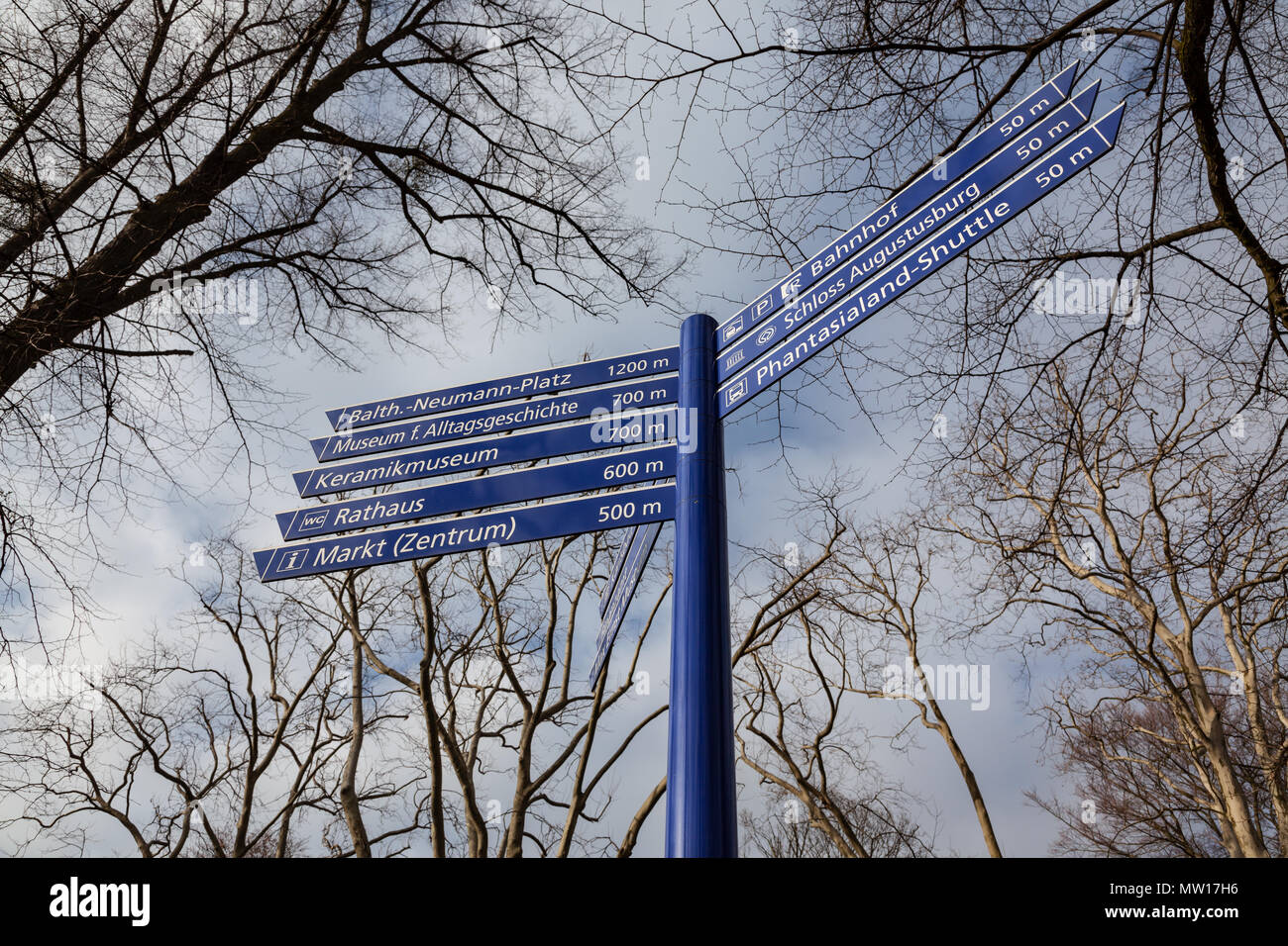 Sign post with 8 blue direction signs in Bruehl, Germany Stock Photo