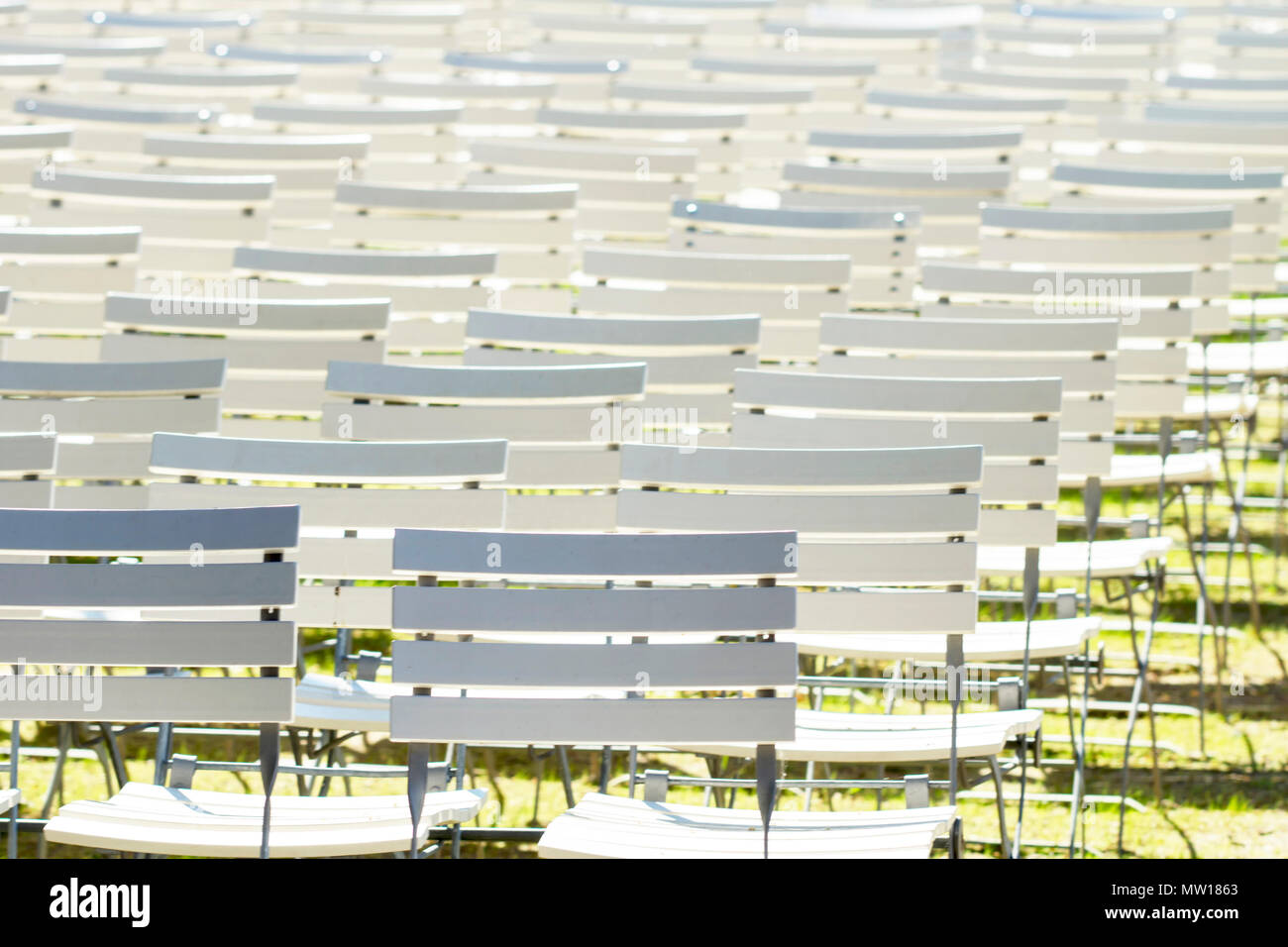 White chair rows in a spa park in medium light Stock Photo