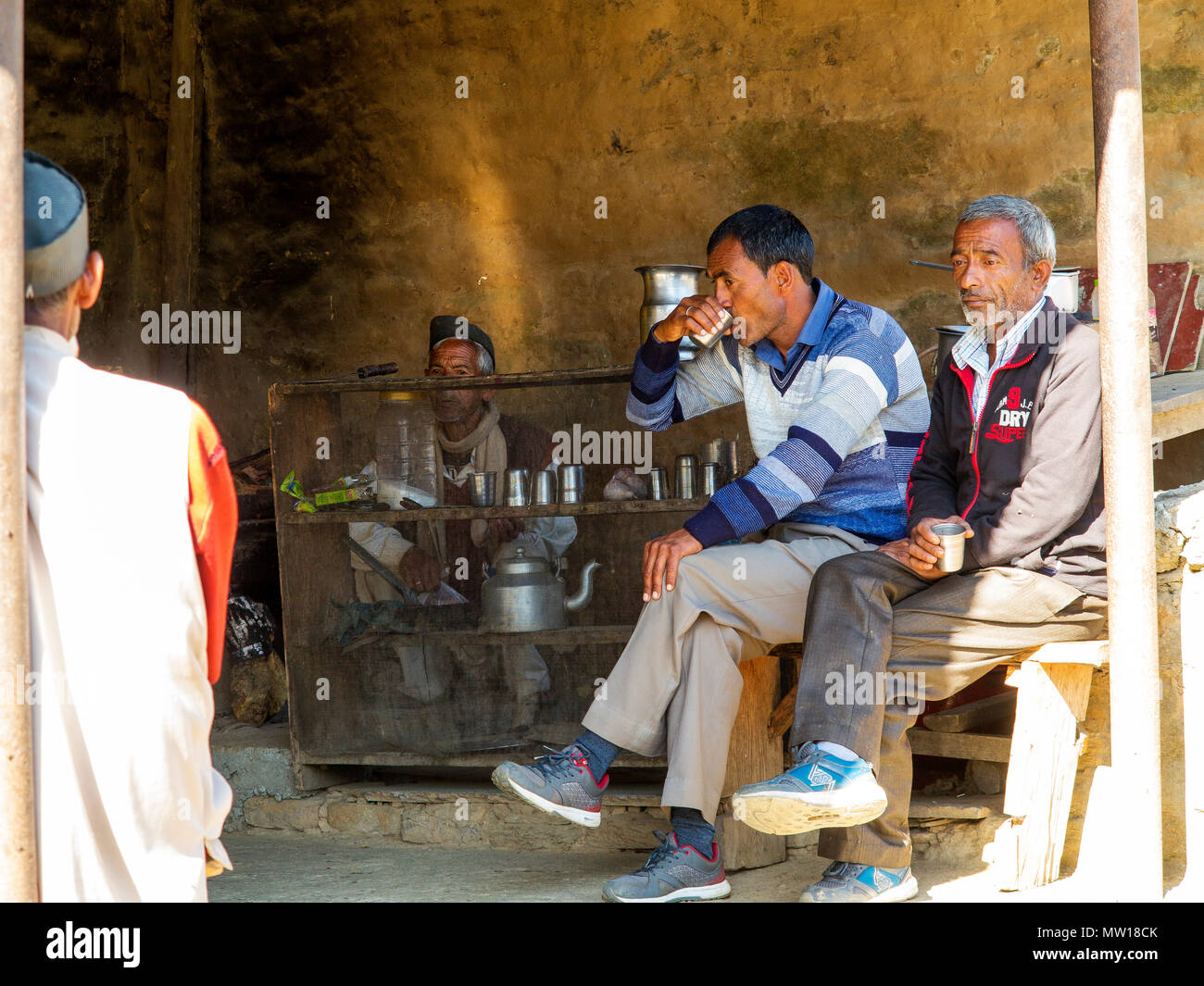 Indian people enjoying a breakfast at a Tea Shop in Lamgara Village, Kumaon Hills, Uttarakhand, India Stock Photo