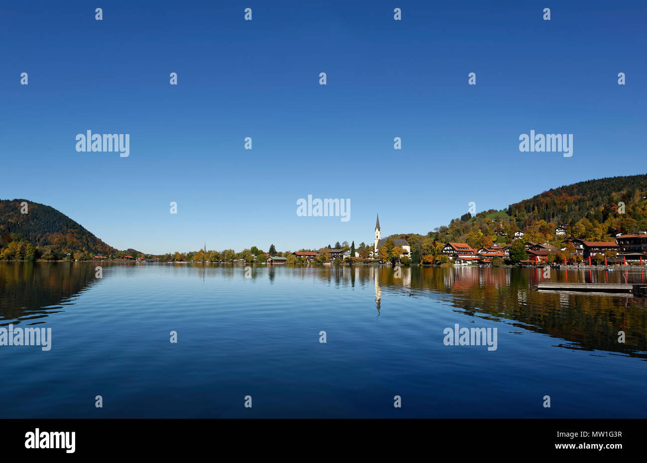View of Schliersee with parish church St. Sixtus and lake, Schliersee, Upper Bavaria, Bavaria, Germany Stock Photo