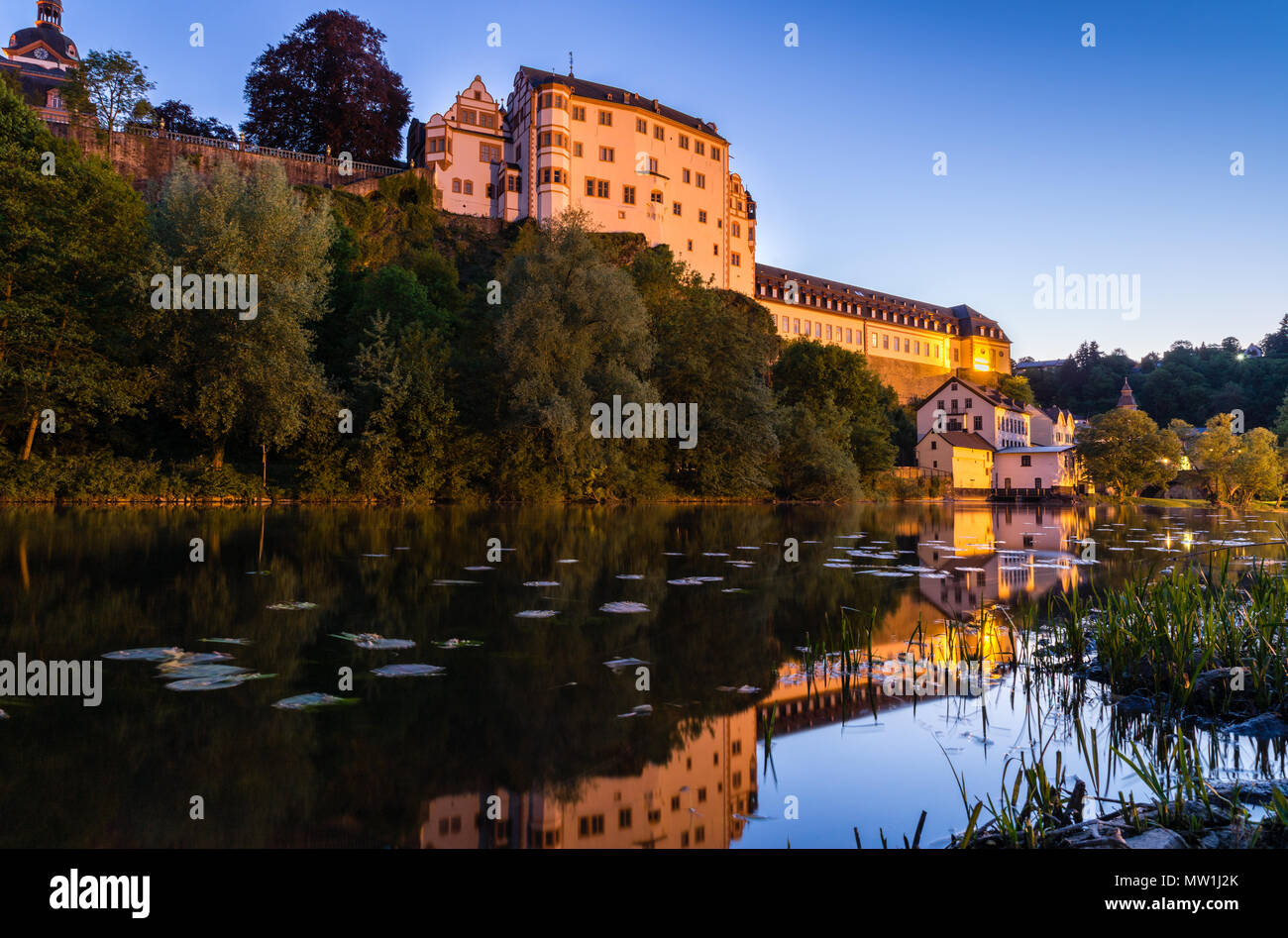 Weilburg Castle, reflection in the river Lahn, dusk, Weilburg an der Lahn, Hesse, Germany Stock Photo