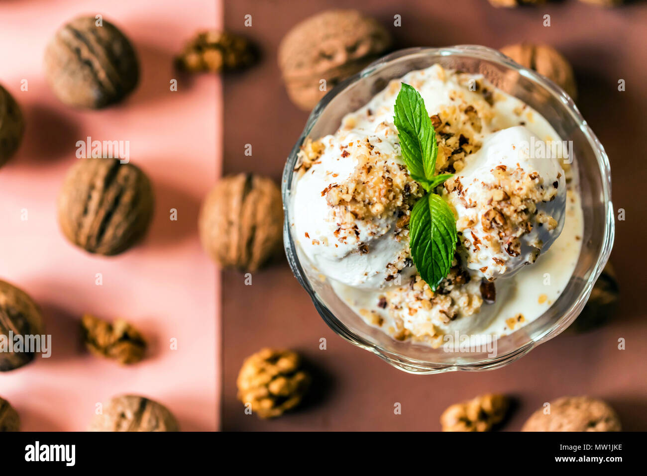 Vanilla ice cream in bowl and walnuts Stock Photo - Alamy