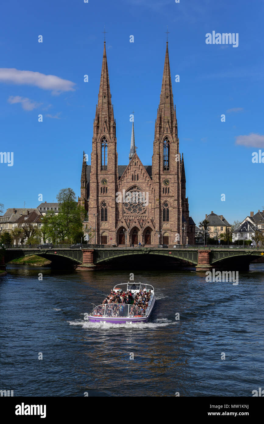 Tourist boat on river Ill with St. Paul's Church, Strasbourg, Alsace, France Stock Photo