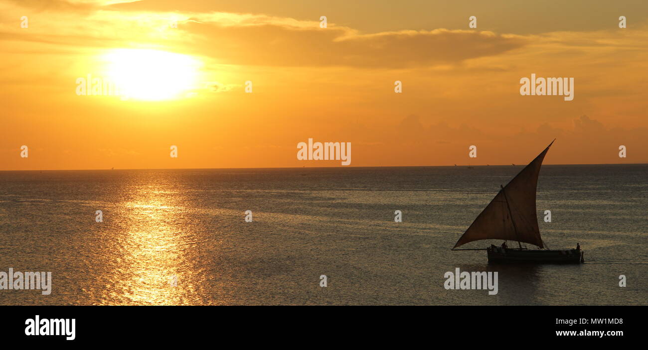 Sailboat during the sunset out on the sea Stock Photo