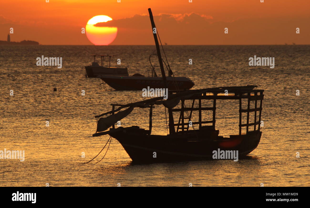 Boats in front of the sunset Stock Photo