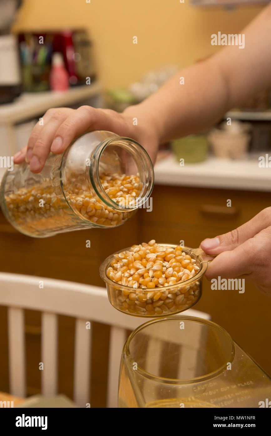 Making popcorn with an electric popper at home Stock Photo Alamy