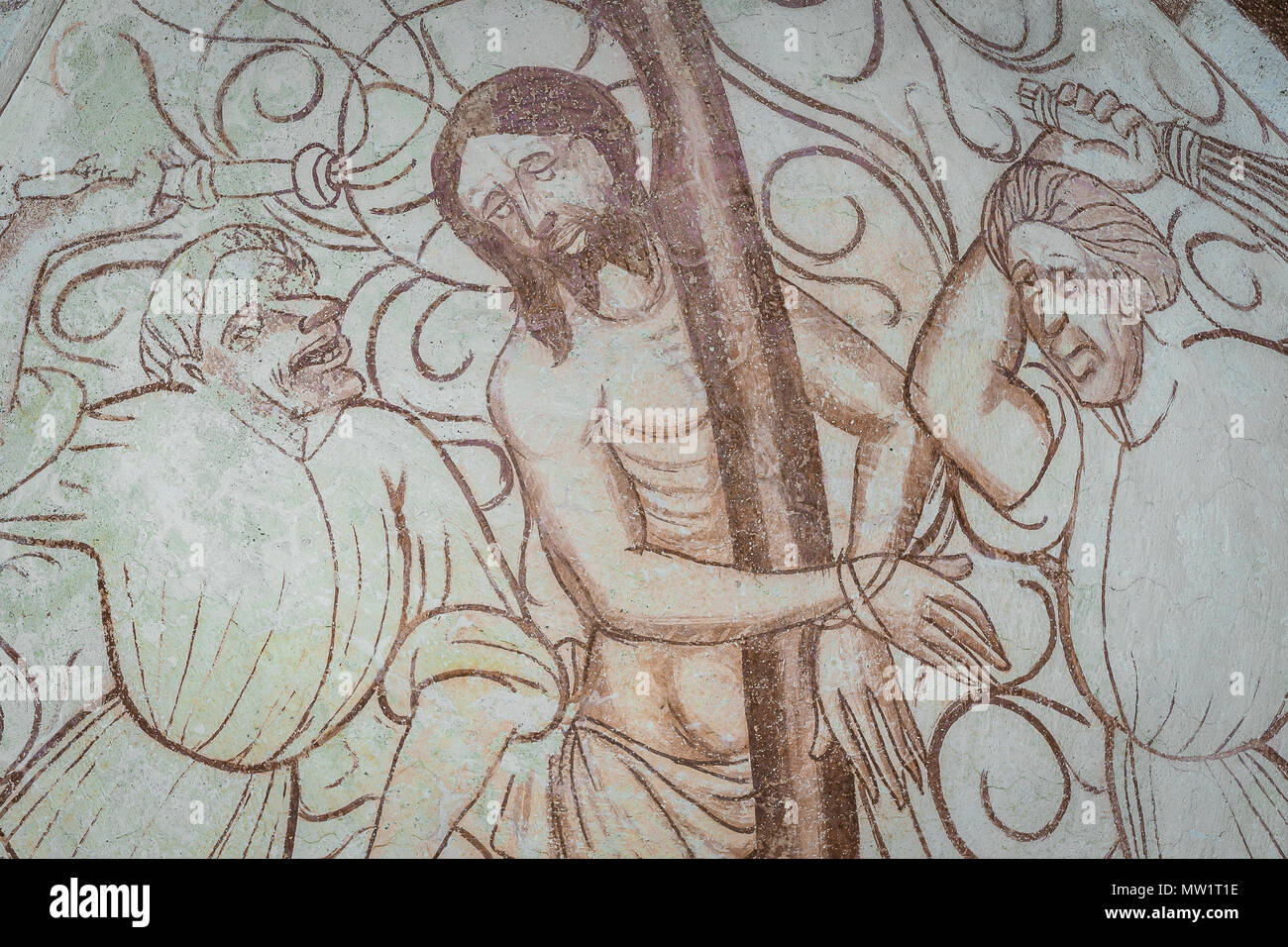 Jesus i tortured by two men, whipping him with lashes, a gothic church fresco in Bronnestad, Sweden, May 11, 2018 Stock Photo