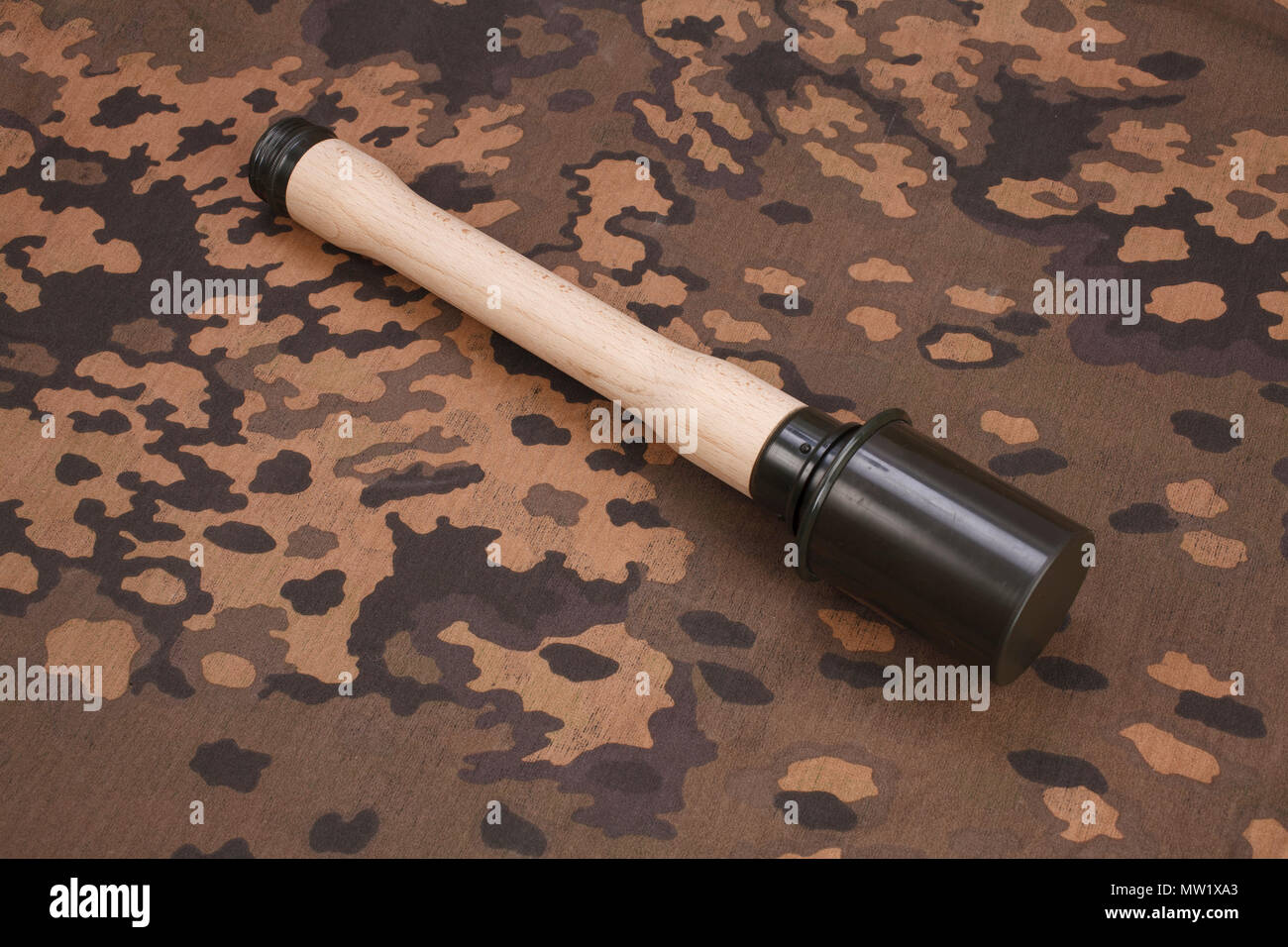 german nazi camouflage uniform with hand grenade and bayonet Stock Photo