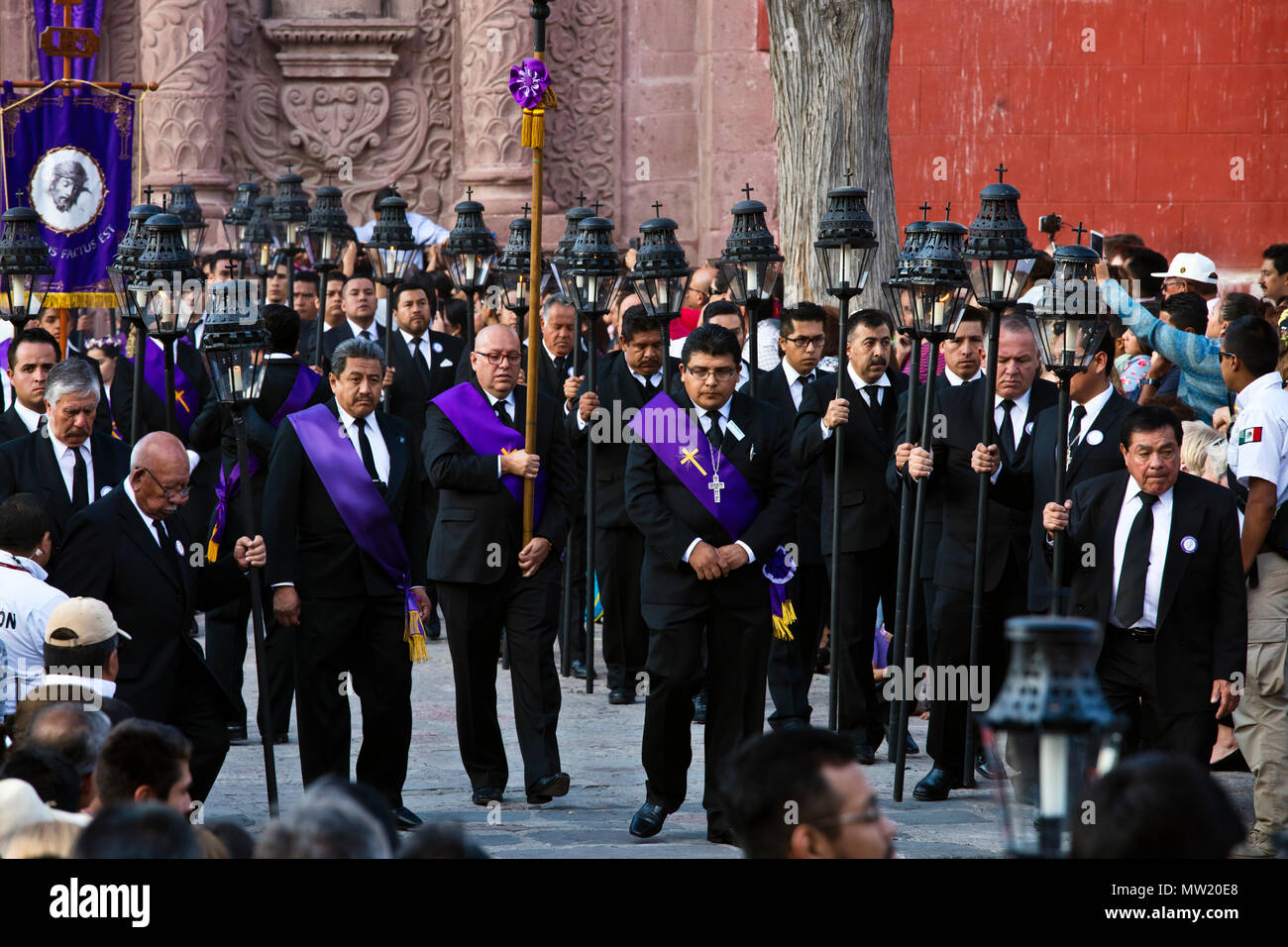 Mexican men carry candle lanterns in the Good Friday Procession, known as the Santo Entierro, from the ORATORIO CHURCH - SAN MIGUEL DE ALLENDE, MEXICO Stock Photo
