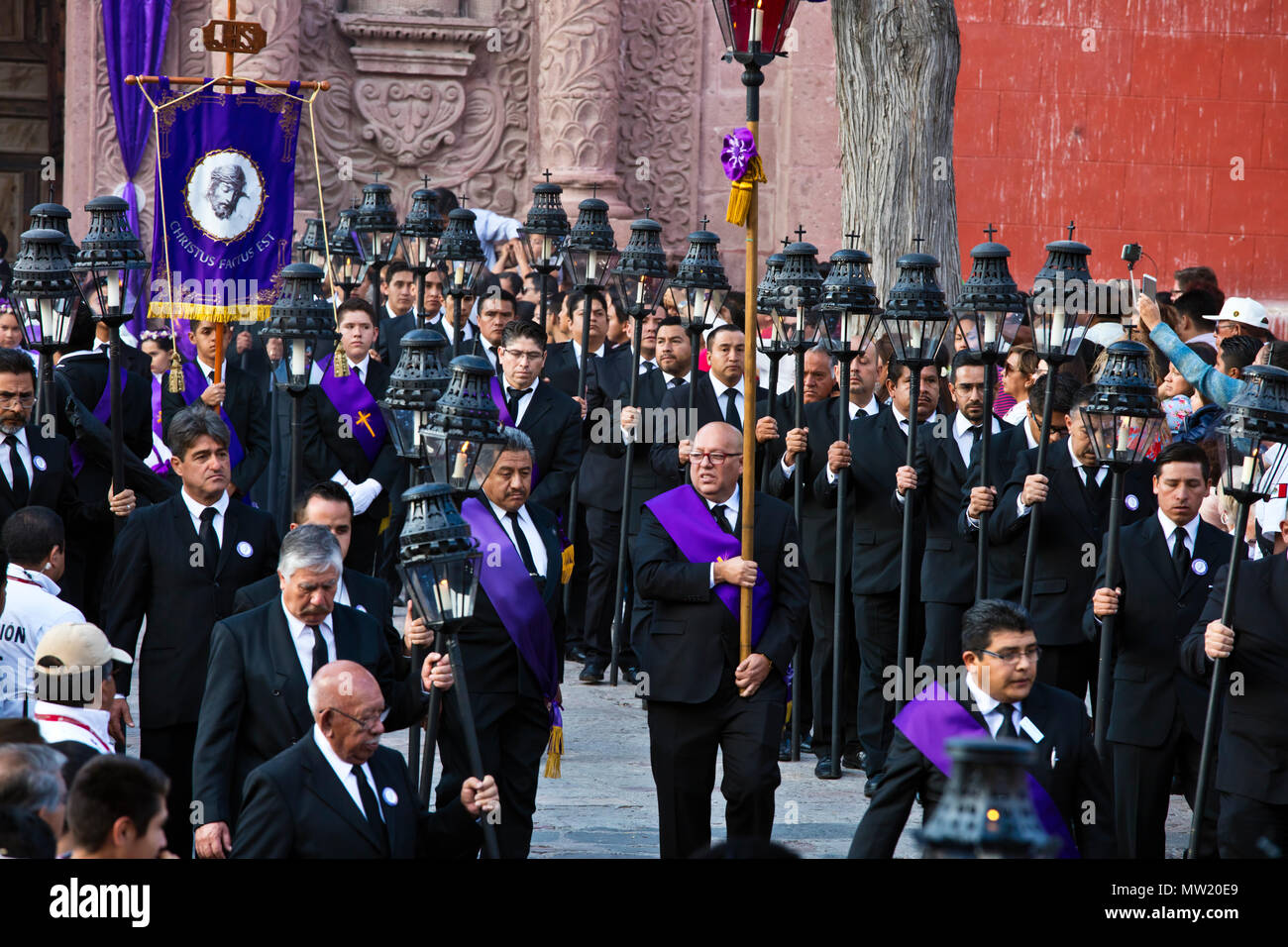 Mexican men carry candle lanterns in the Good Friday Procession, known as the Santo Entierro, from the ORATORIO CHURCH - SAN MIGUEL DE ALLENDE, MEXICO Stock Photo