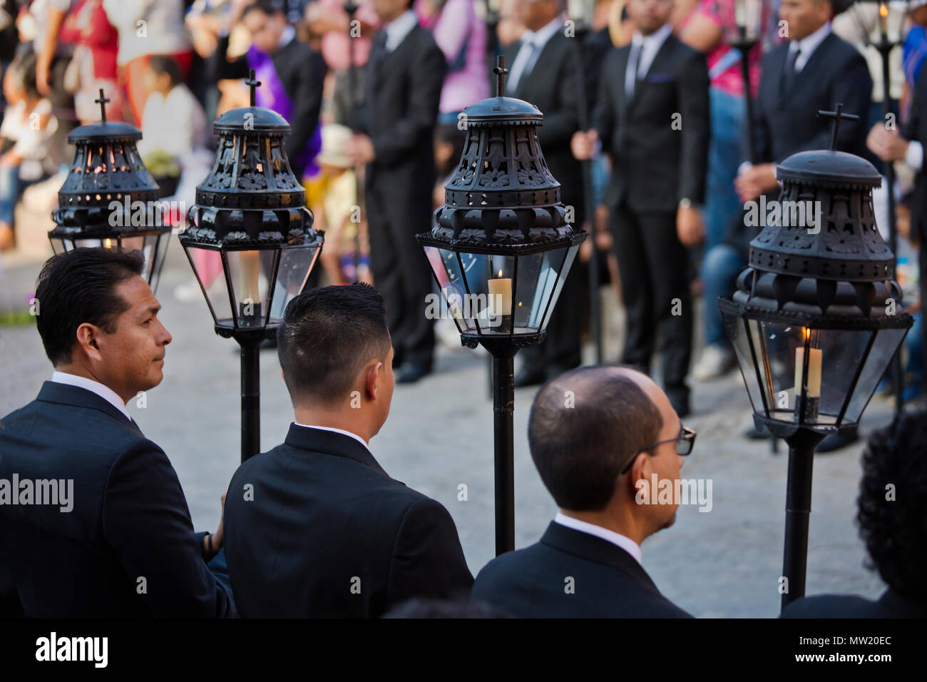 Mexican men carry candle lanterns in the Good Friday Procession, known as the Santo Entierro, from the ORATORIO CHURCH - SAN MIGUEL DE ALLENDE, MEXICO Stock Photo