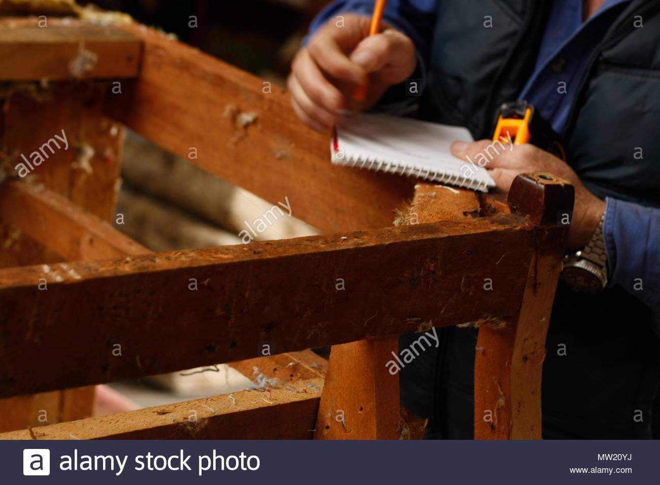 Experienced Hands Of An Australian Man Repairing And