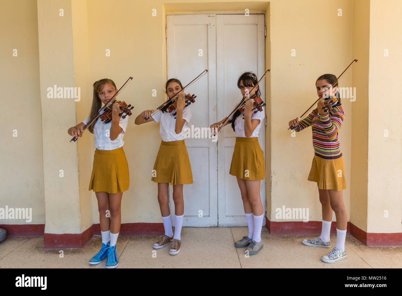 Young students practice violin at the Benny More School of Art Cienfuegos, Cuba. Stock Photo