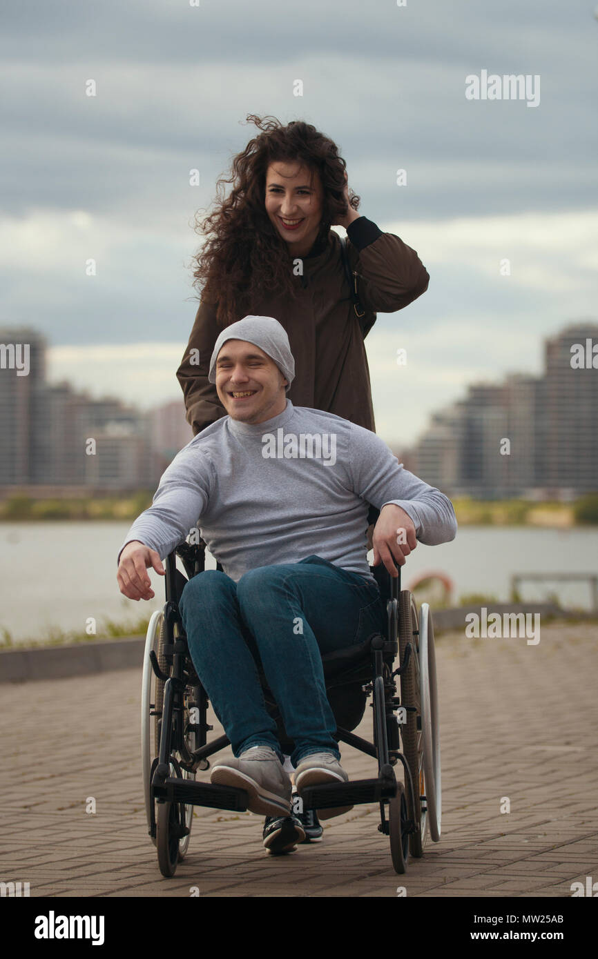 Man woman in wheelchair silhouette hi-res stock photography and images ...