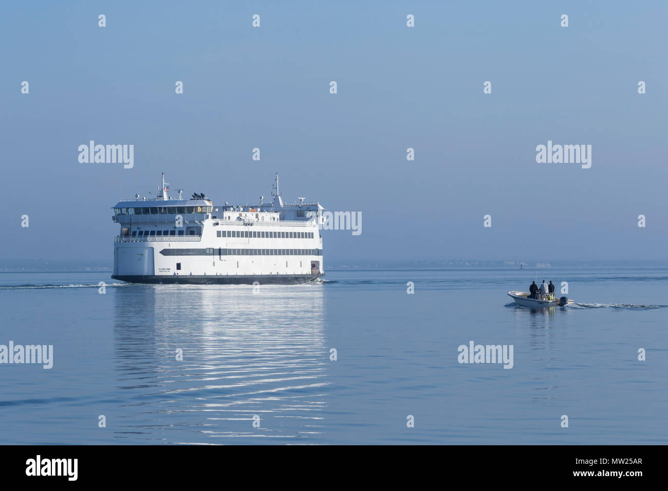 Steamship Authority ferry 'MV Island Home' leaves Vineyard Haven harbor on Martha's Vineyard headed for Woods Hole on the mainland. Stock Photo