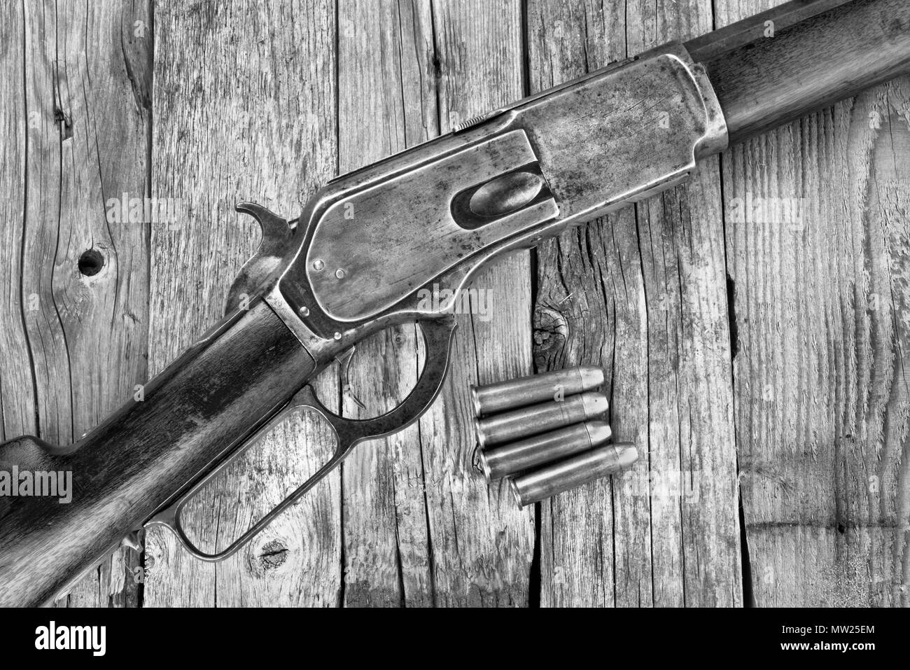 Antique 1876 lever action cowboy rifle in black and white. Stock Photo