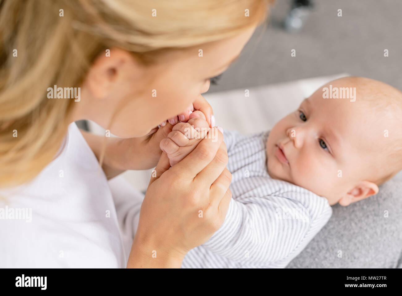 selective focus of mother holding babys hands Stock Photo Alamy