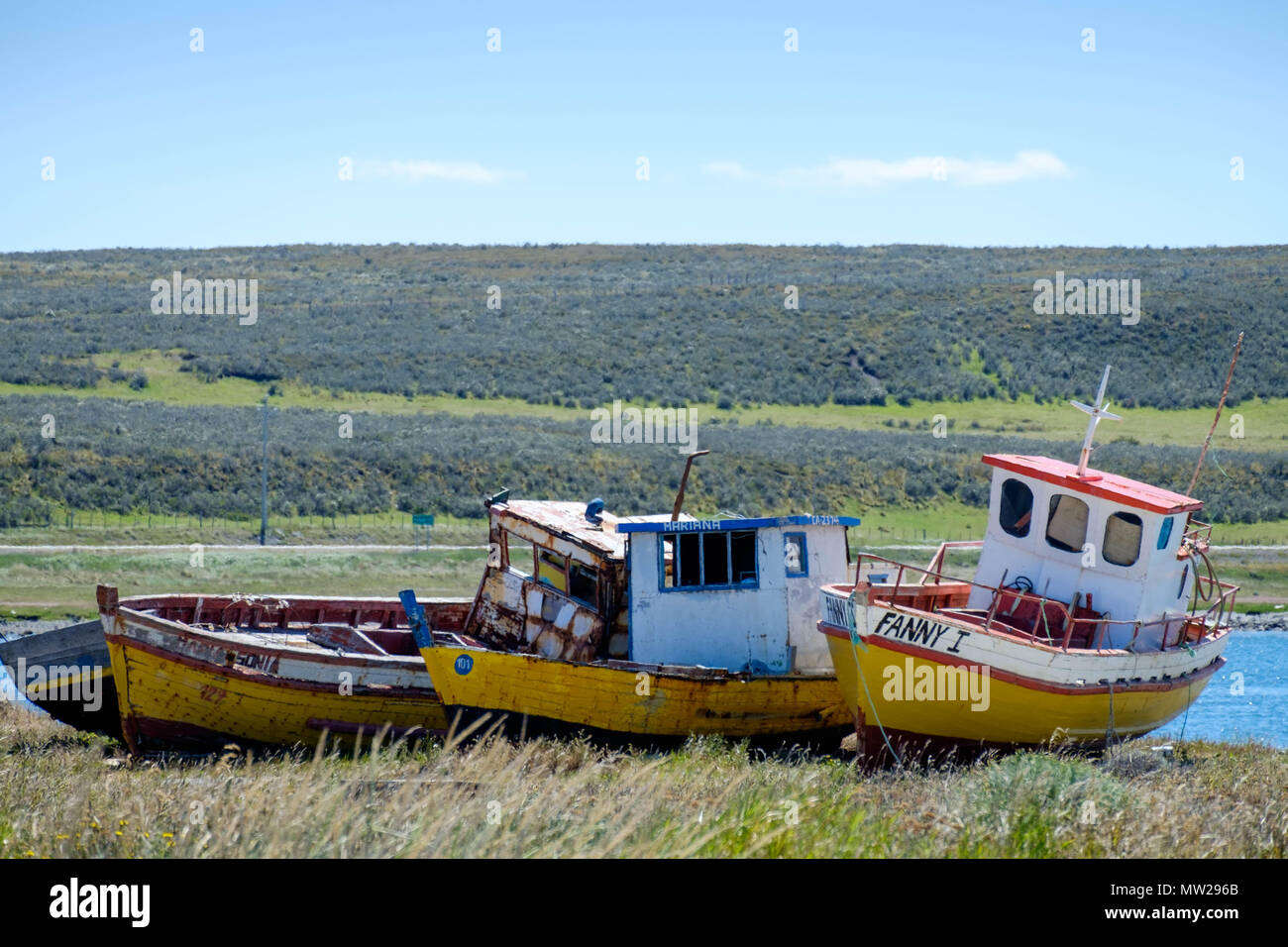 Abandoned fishing boats lie at the bay of Porvenir, the small capital of the Chilean province of Tierra del Fuego. Stock Photo