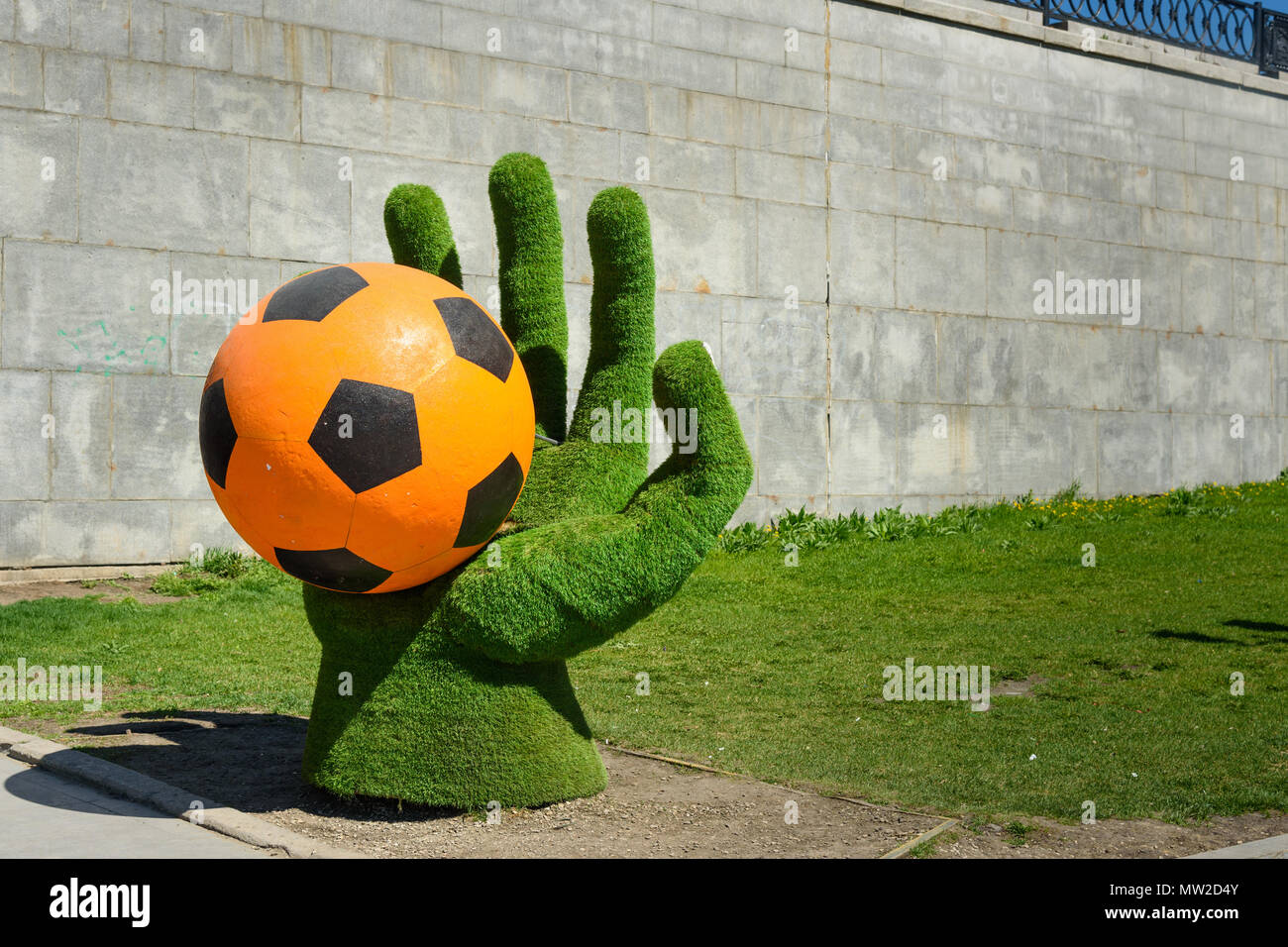 Yekaterinburg, Russia - May 23, 2018: Installation of the Hand with ball for World Cup on Historical Square on Iset River in center of city Stock Photo