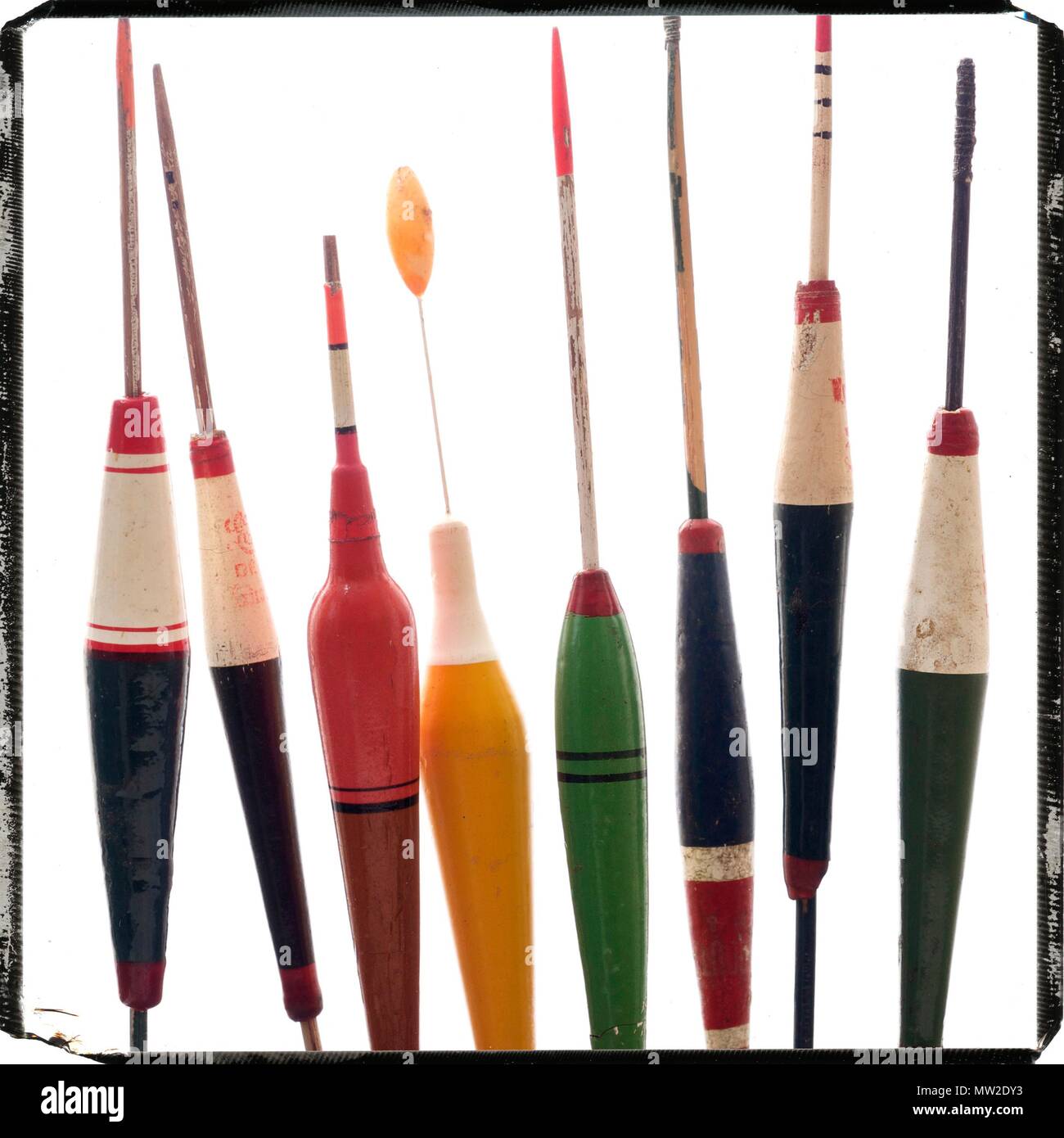 Vintage fishing floats, nestled between the pages of old book on Angling  Stock Photo - Alamy