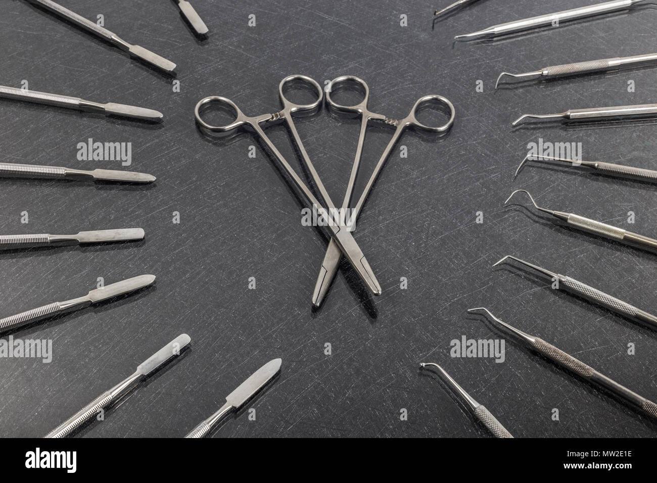 Two dental scissors with different dental instruments Stock Photo Alamy