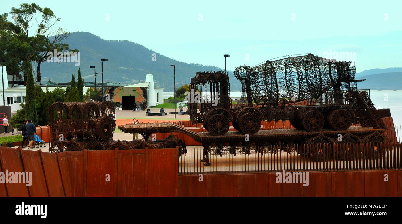 A concrete mixer depicted in pierced metal, looking across to the main entrance to MONA Stock Photo