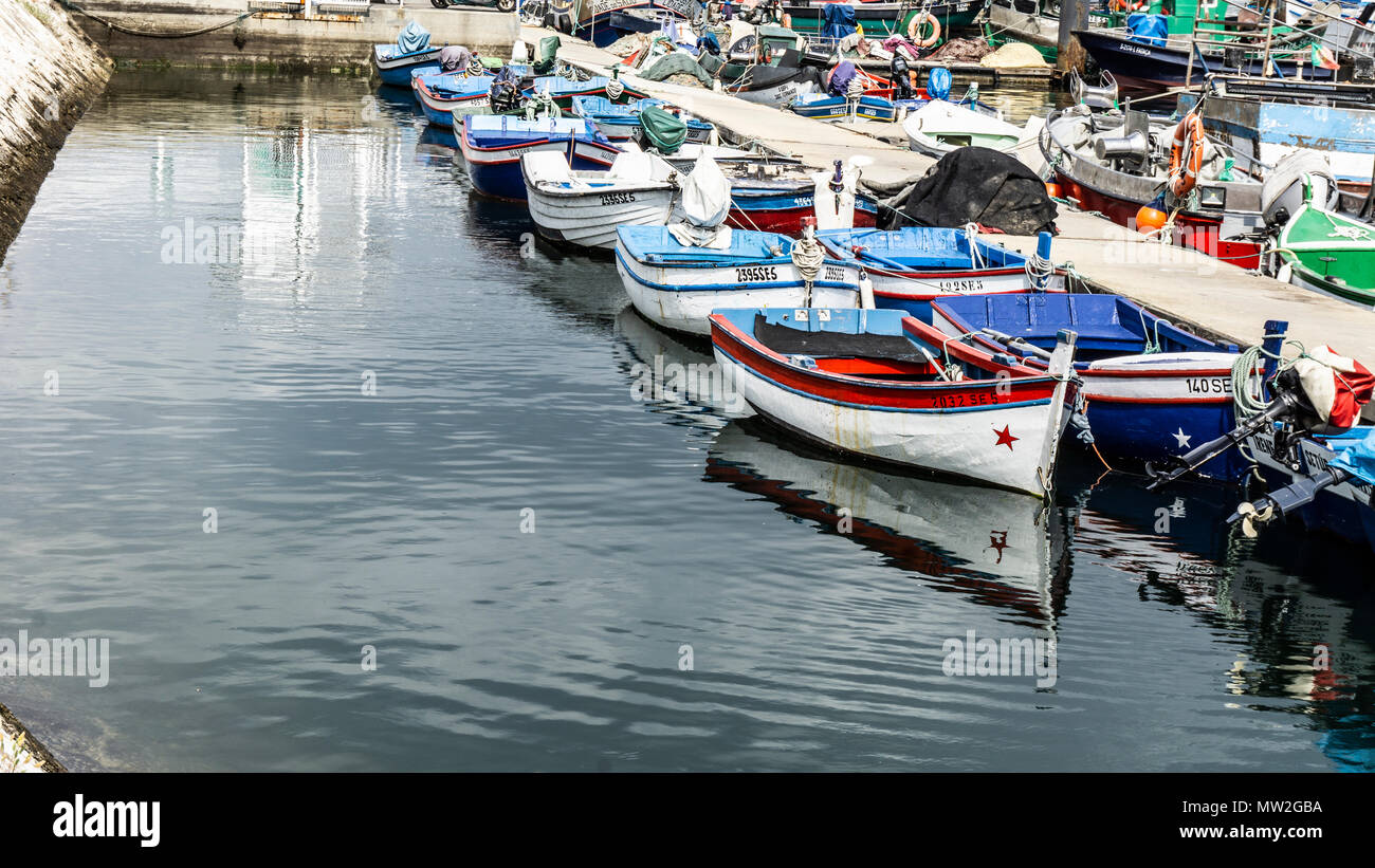 small fishing boats moored in port of many colors Stock Photo - Alamy