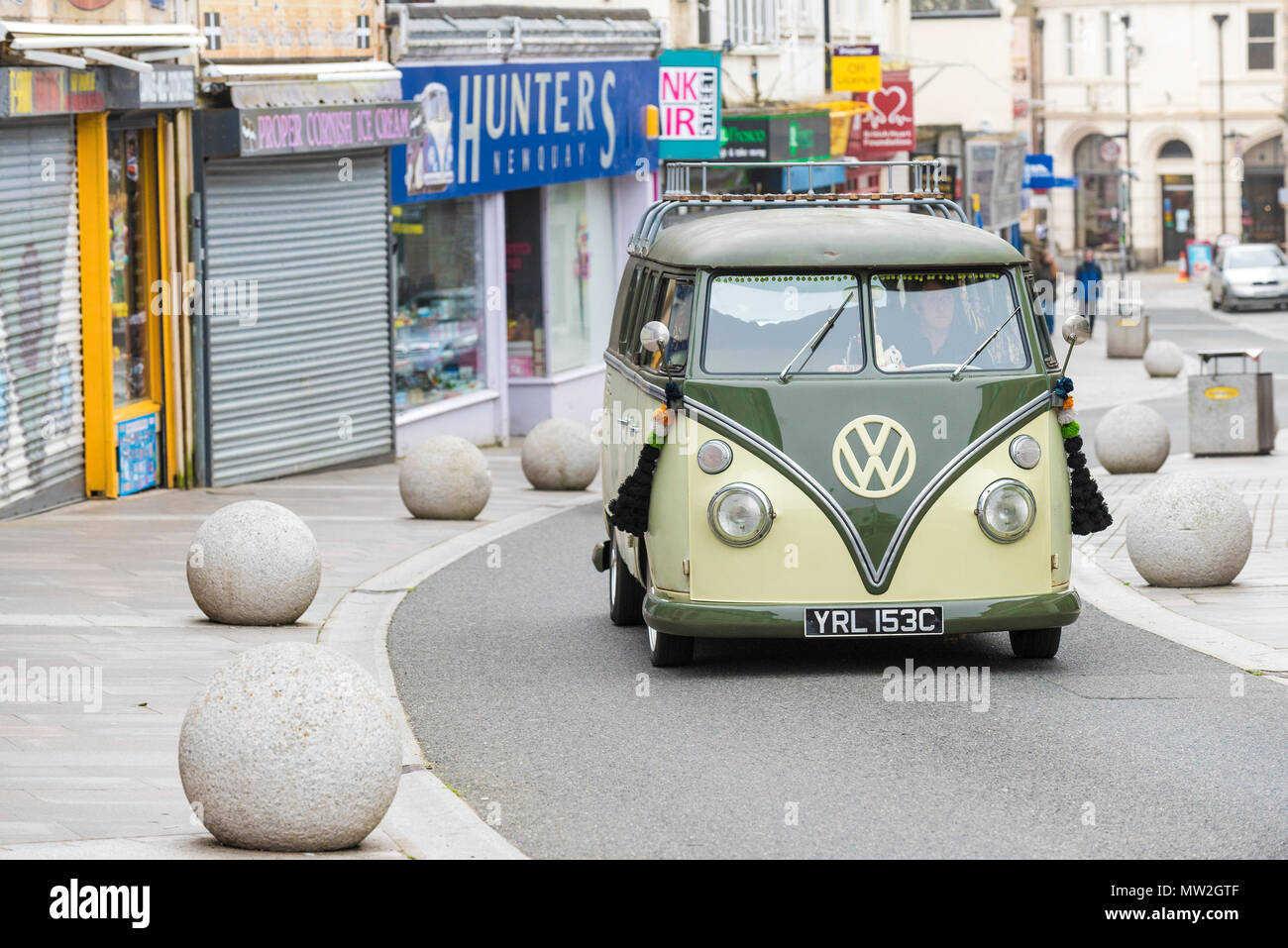 A restored split screen vintage Volkswagen Camper van in Newquay Town Centre in Cornwall. Stock Photo