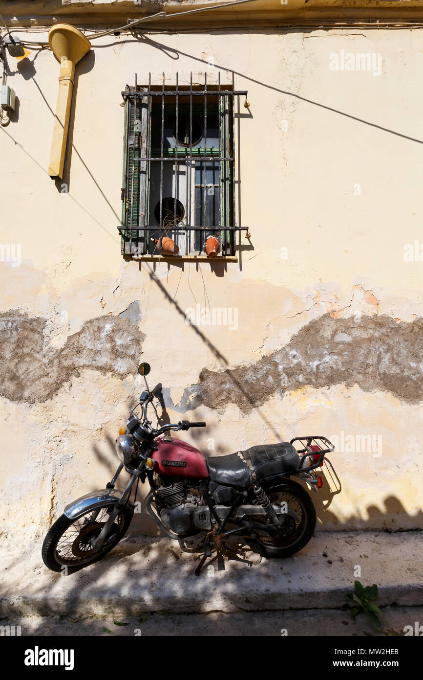Athens, Greece - May 26, 2018: An old motorbike in a street of Plaka neighbourhood in Athens, Greece. Stock Photo
