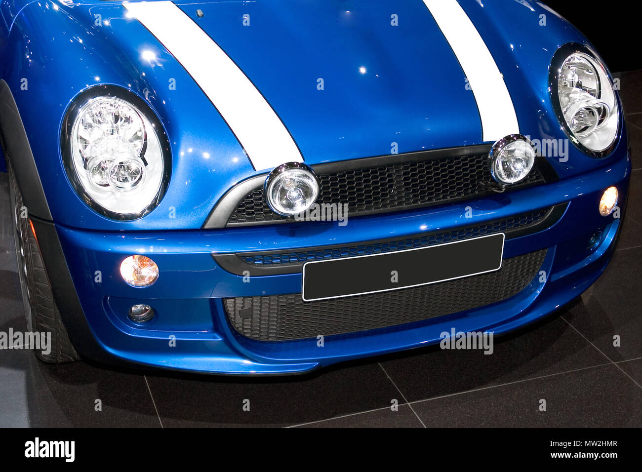 Front end of a blue Mini Cooper car. More car photos available in my gallery. Stock Photo