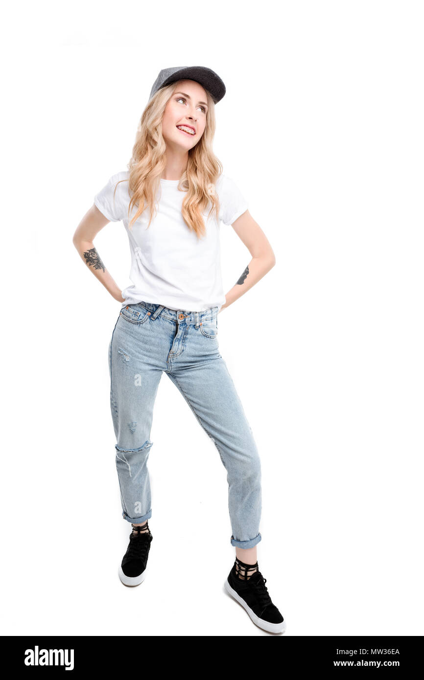 Full length shot of young caucasian woman wearing casual posing with arms akimbo. Stock Photo