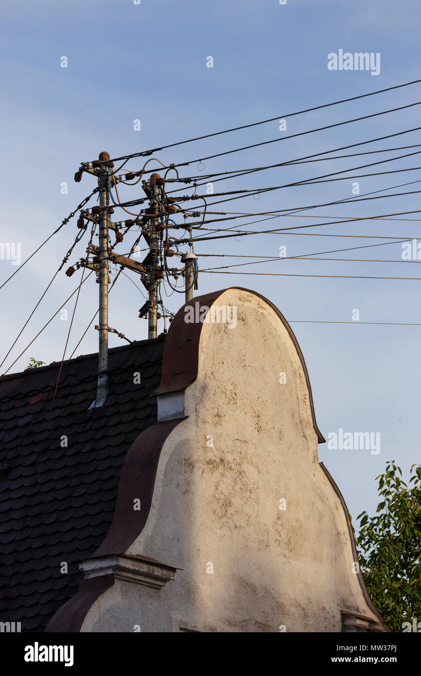 Power lines on a gabled roof in Bavaria Stock Photo