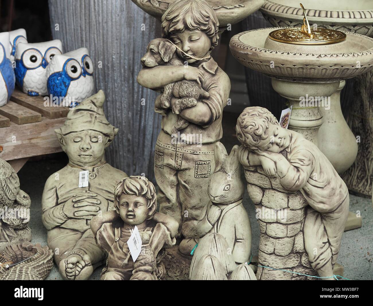 Boy with Dog Kneeling Statue, Boy fishing, Concrete statues, fishing