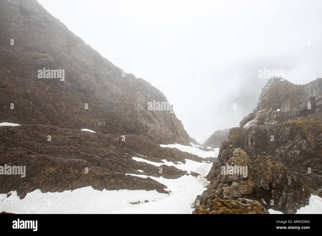 The top of the mountain is covered with snow and fog. Landscape in  Switzerland Stock Photo - Alamy