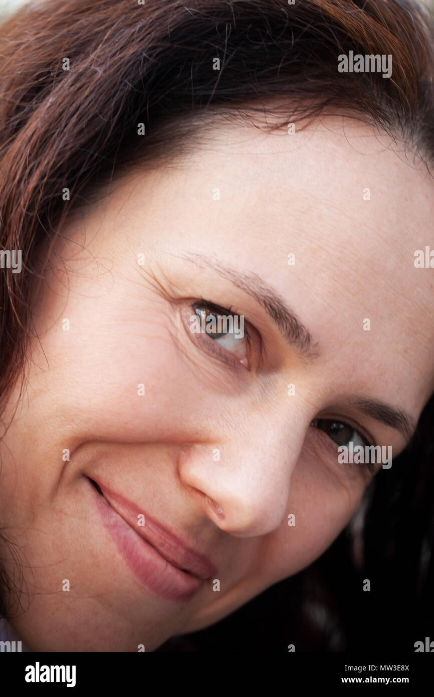 Positive smiling young adult European woman, close-up face portrait Stock Photo